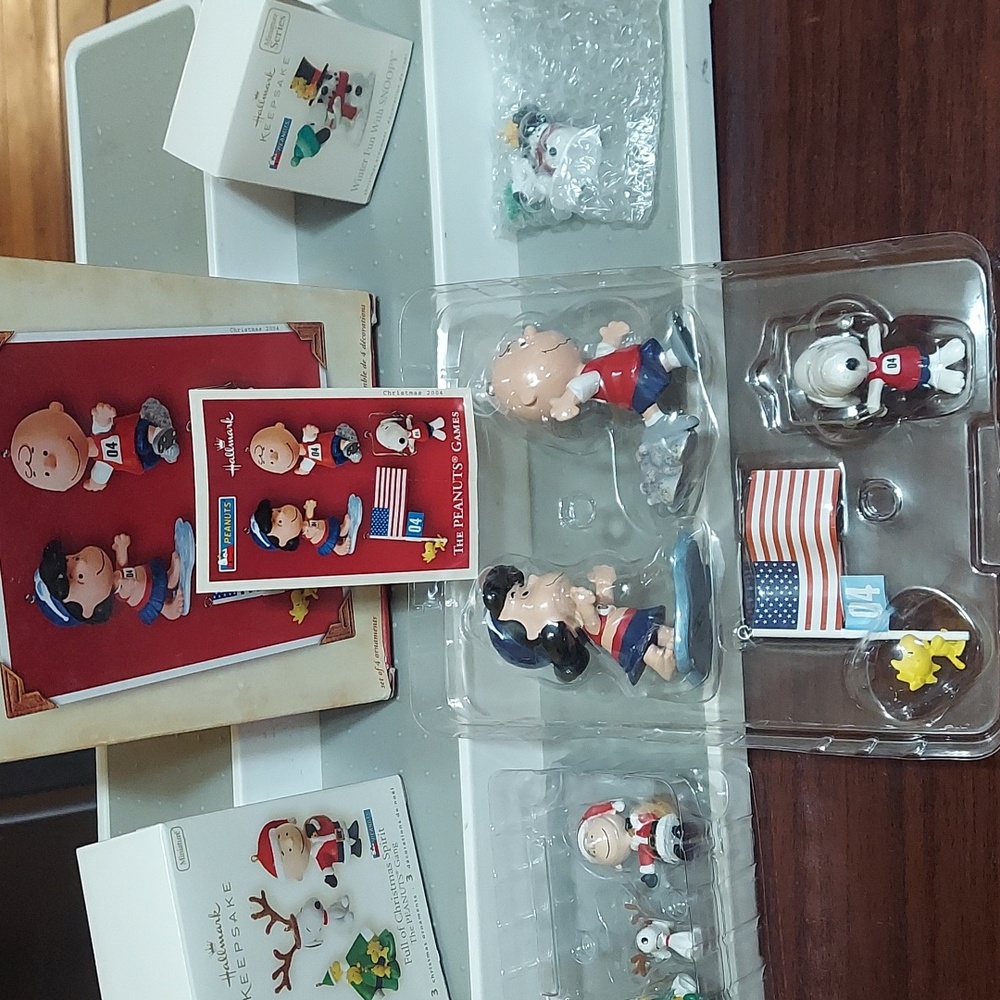 Hallmarks Keepsake ornaments.  Peanuts games,peanuts gang, fun with snoopy. New.